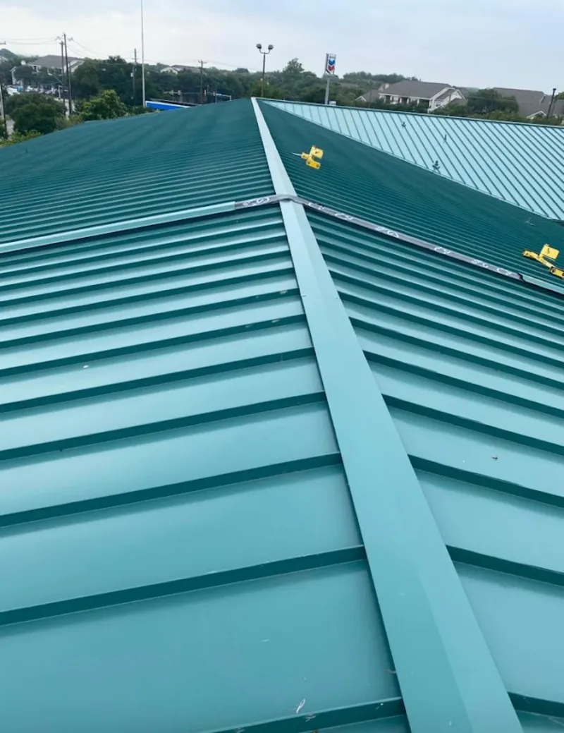 Green commercial metal roof ridge and valley for Metal Roof Repair in Englewood